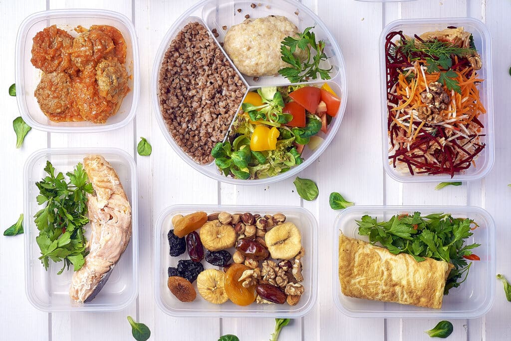 Meal prep containers filled with prepared food