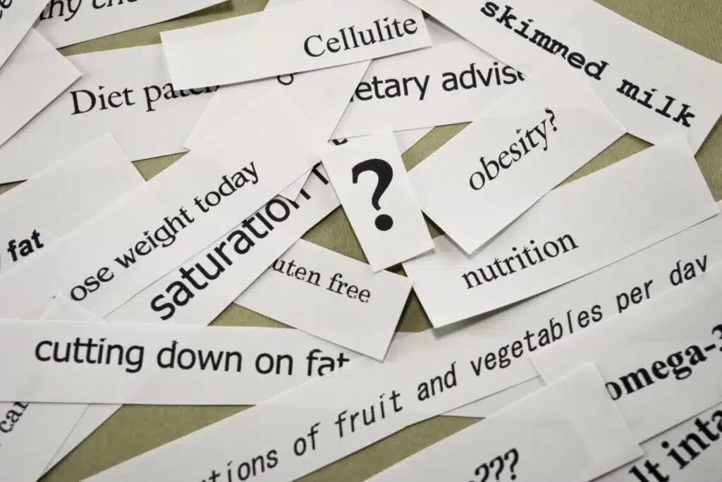 Scraps of paper printed with conflicting diet and nutrition claims