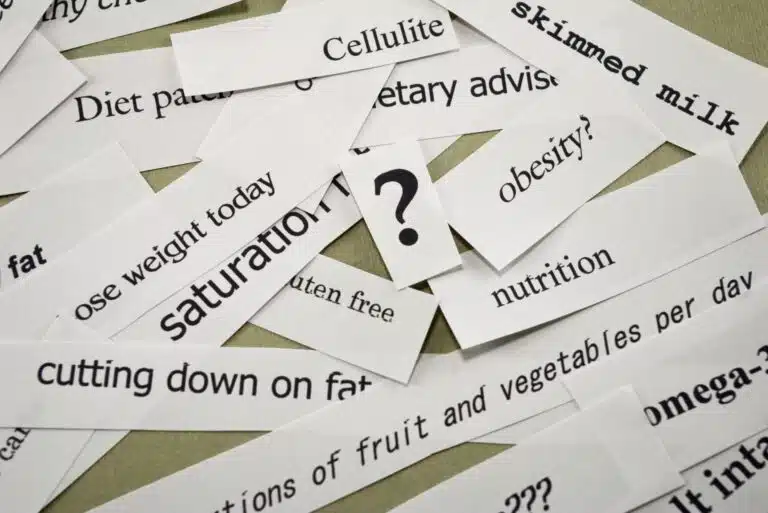 Scraps of paper printed with conflicting diet and nutrition claims