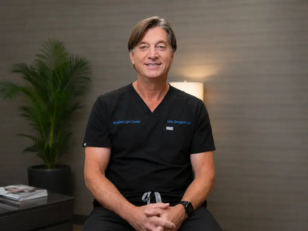 John Bergeron, MD, Founder and Medical Director of Houston Weight Loss Center, wearing medical scrubs